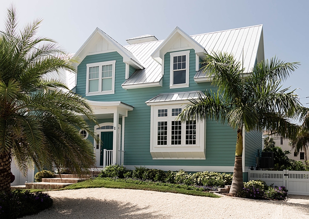 Viwinco OceanView picture, double-hung, casement, and geometric windows installed in New England style home.