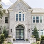 Viwinco OceanView white single-hungs, transoms, and half-round windows installed in Colonial home remodel.