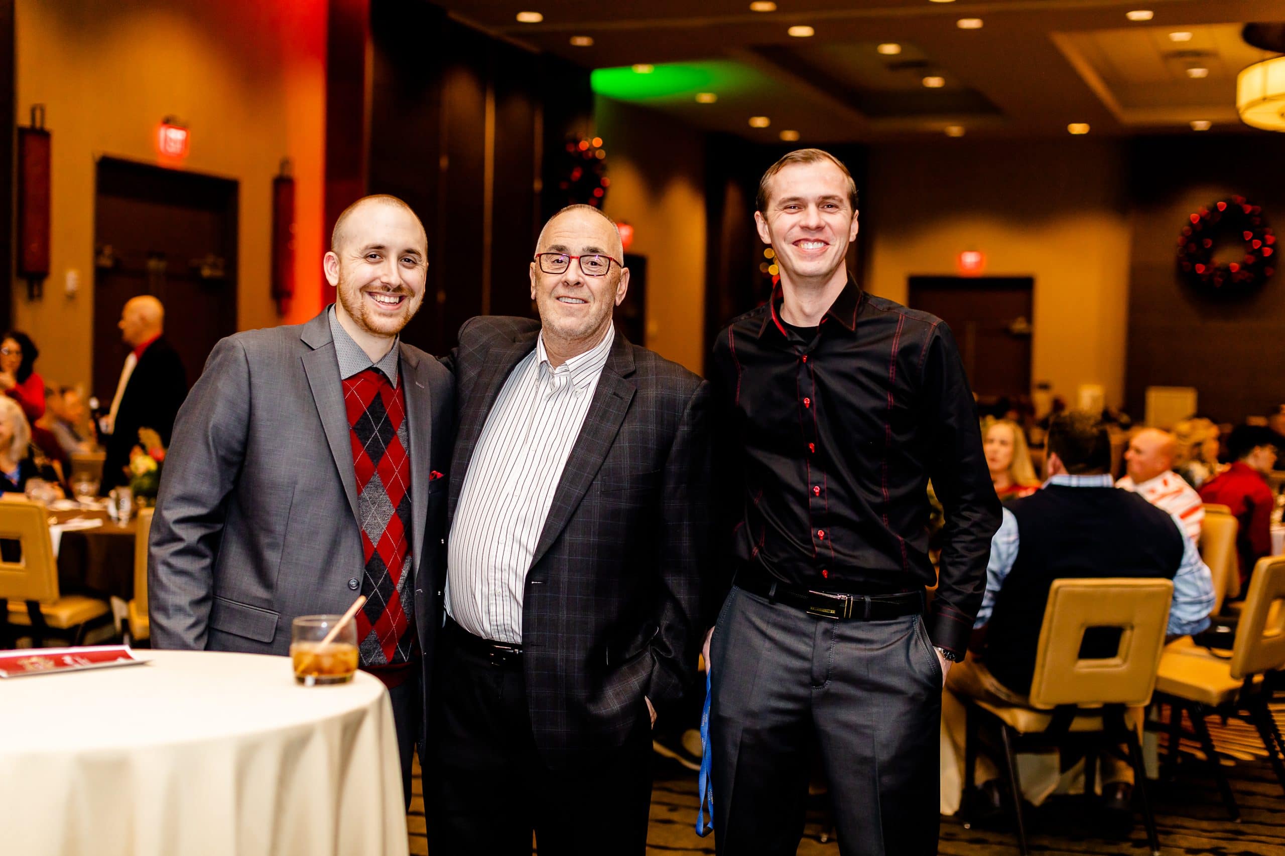Three men posing together at the 2021 Viwinco Holiday Party.