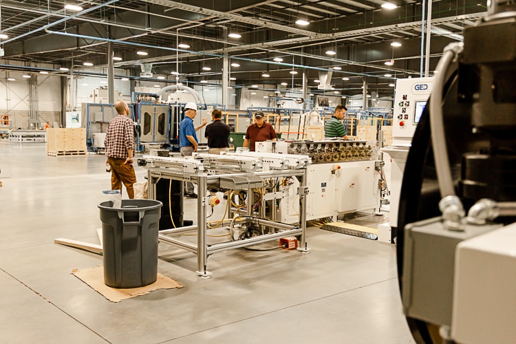 Viwinco staff in new glass facility at glass shop grid station.