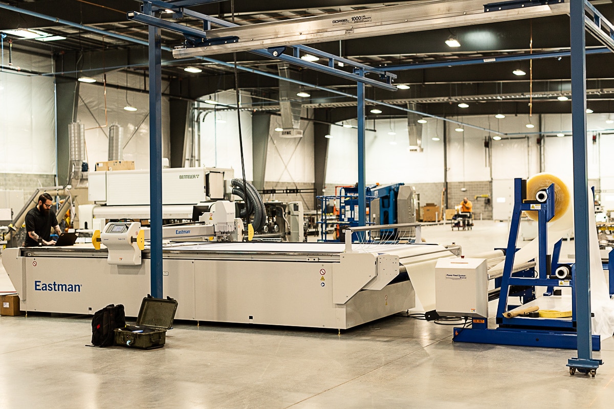 Wide shot of Eastman PVB Cutter in new Viwinco glass facility.