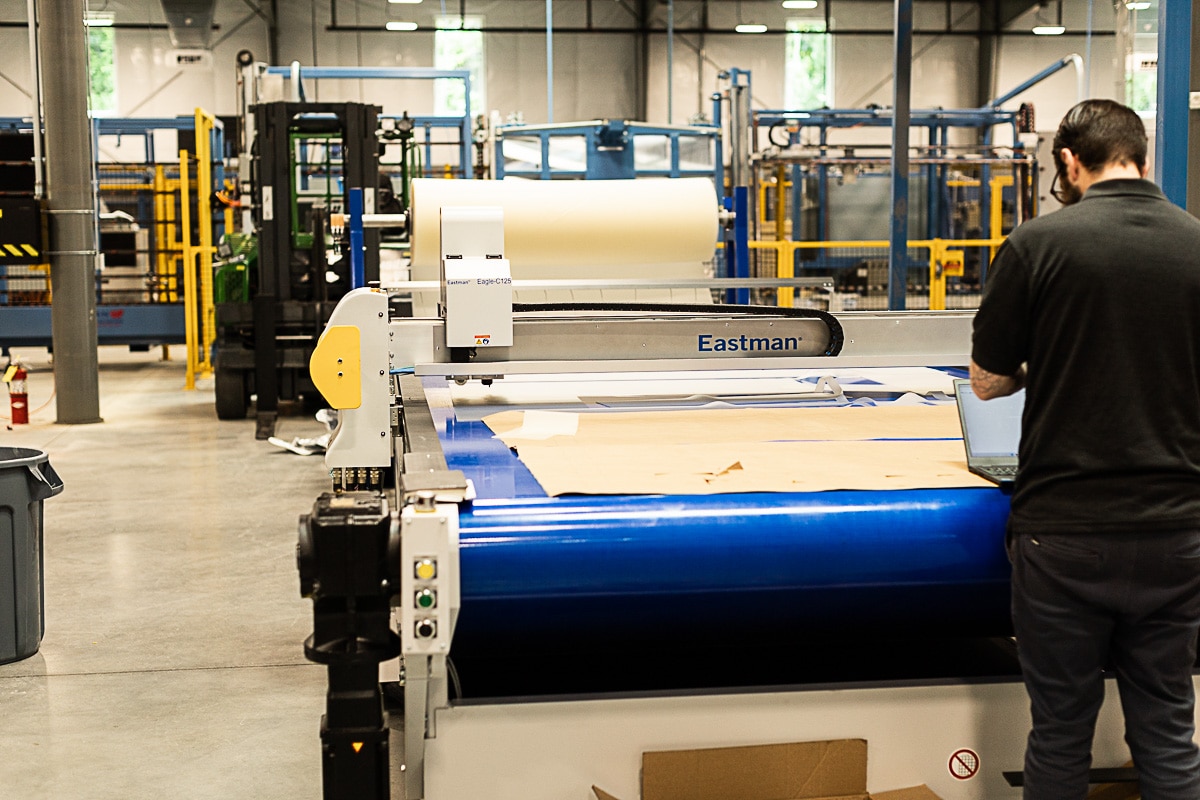 Employee working at Eastman PVB Cutter in new Viwinco glass facility.