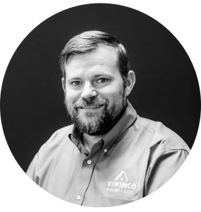 Black and white portrait of team member, Kyle.