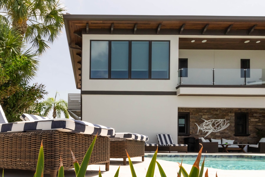 Modern-Coastal home with Viwinco bronze energy-efficient impact windows