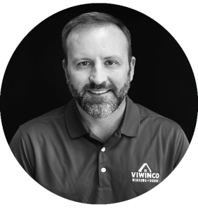 Black and white headshot of Tom, sales representative.